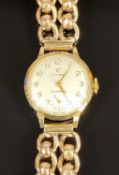 CYMAFLEX 9CT GOLD LADIES WRISTWATCH, circular dial with gold Arabic numerals and subsidiary