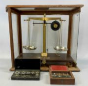 GRIFFIN & TATLOCK LTD. CHEMIST SCALES in glazed mahogany case, 40 (h) x 45 (w) x 23cms (d) with a