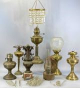 GROUP OF BRASS OIL LAMPS and a pendant ceiling light fitting with cut glass drops Provenance: