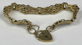 9CT GOLD GATE LINK BRACELET with heart shape locket and safety chain, 13.8gms Provenance: private