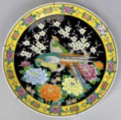 JAPANESE FAMILLE NOIR CIRCULAR CHARGER, decorated with pheasants and flowers, yellow enamel