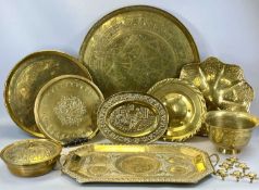 BRASSWARE including a large circular Eastern tray, 64cms (diam.), three smaller circular trays, oval