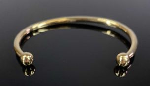 YELLOW METAL TORQUE BANGLE, unmarked, 3.8gms, inside width 5.5cms Provenance: private collection