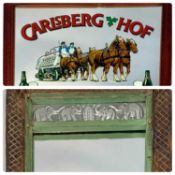 TWO DECORATIVE WALL MIRRORS, the first with carved hardwood frame and with metal insets embossed