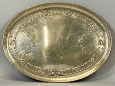 GEORGE V SILVER OVAL TRAY, repousse decoration of trailing vines and flowers, London 1910, William