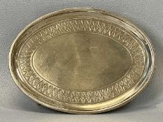 GEORGE III SILVER OVAL CARD TRAY with chased border, raised on four feet, London 1800, 16 x 12cms,