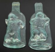 WILLIAM MASON pair of glass sculptures - bottles with raised torso, with certificate dated 2007,
