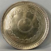 CIRCULAR SILVER CARD TRAY with beadwork rim, pierced border, chased decoration on shell cast feet,