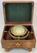 VINTAGE COOKE OF HULL BRASS CASED SHIP'S COMPASS, mounted on gimbal in stained plywood box with