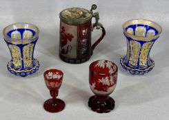 BOHEMIAN GLASSWARE STEIN, red and clear, the hinged porcelain cover depicting a sleeping fox,