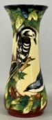 MOORCROFT 'INGLEWOOD' VASE decorated with woodpecker and garden birds, signed Philip Gibson 2002,