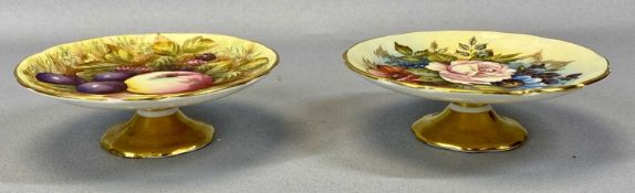 TWO SMALL AYNSLEY COMPORTS, the first painted with flowers and signed 'J A Bailey' No 1304, the