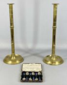 A PAIR OF BRASS 'RISE & FALL' CANDLESTICKS, 45cms (h), 16cms base, and a cased set of hallmarked