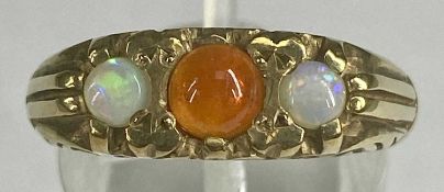9CT GOLD RING set with central orange garnet, flanked by opals, size P, 5.7gms Provenance: private