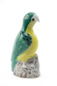 CHINESE FAMILLE VERTE PARROT, 18th C., green and yellow plumage over black details, perched on an