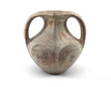 CHINESE TWIN-HANDLED BLACK POTTERY JAR, Han Dynasty (206BD-AD220), each side carved with two