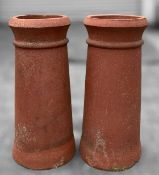 PAIR OF TERRACOTTA CHIMNEY POTS, 63 (h) x 29cms (dia. at base) Provenance: consigned via West