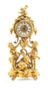 MODERN GILT BRASS FIGURAL MANTEL CLOCK, base as standing putti and dolphin on rococo base, 38 (h)