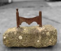 ANTIQUE CAST IRON BOOT SCRAPER, set in rectangular stone block Provenance: consigned via West