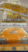 THREE MODERN CHINESE WASHED WOOL RUGS, largest decorated with dragon medallion and spandrels, shou-