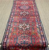 HERIZ RUNNER, Northwest Iran, stylised geometric vines and metaddions, 285 x 92cms Provenance: