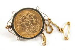 GEORGE V GOLD SOVEREIGN, 1913, in 9ct gold scroll brooch mount, 11.3gms Provenance: private