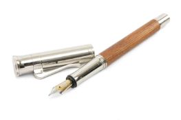GRAFF VON FABER-CASTELL 'CLASSIC' FOUNTAIN PEN, ribbed wood barrel and polished steel cap and