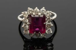 18CT WHITE GOLD BELIEVED SPINEL & DIAMOND CLUSTER RING, the central claw set rectangular stone (9