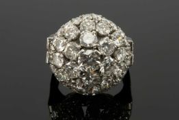 PLATINUM DIAMOND ENCRUSTED DOME COCKTAIL RING, the central stone (0.5cts approx.) withing three