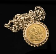 GEORGE V GOLD HALF SOVEREIGN, 1913, in yellow metal scroll pendant mount on 9ct gold oval link