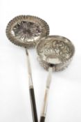 TWO GEORGE III SILVER TODDY LADLES, both with twisted handles, one by Thomas Ellis with oval