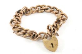 9CT GOLD CURB LINK BRACELET, heart shaped padlock, 18.5gms Provenance: private collection