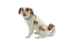 RARE MEISSEN MODEL OF A BOLOGNESE TERRIER, the dog seated on its haunches with head turned, bow