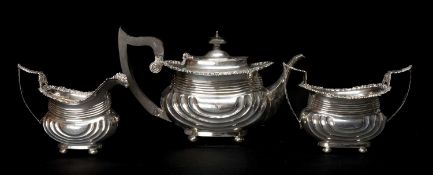 EDWARD VII THREE PIECE SILVER TEASET comprising teapot, cream jug and sucrier, engraved with