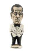 THE RUGBY UNION / FILM CLUB HOUSE: GROGG MODEL OF HUMPHREY BOGART BY JOHN HUGHES standing on a