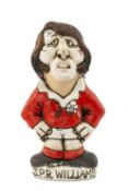 THE RUGBY UNION CLUB HOUSE: GROGG MODEL OF JPR WILLIAMS BY JOHN HUGHES standing on titled base,