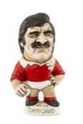 THE RUGBY UNION CLUB HOUSE: WORLD OF GROGGS MODEL OF TOMMY DAVID wearing Wales kit, standing on a
