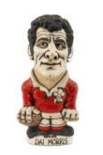THE RUGBY UNION CLUB HOUSE: GROGG MODEL OF DAI MORRIS BY JOHN HUGHES standing on titled base,