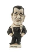THE RUGBY UNION / FILM CLUB HOUSE: GROGG MODEL OF JOHN WAYNE BY JOHN HUGHES standing on a titled