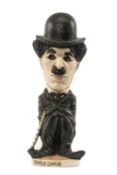 THE RUGBY UNION / FILM CLUB HOUSE: GROGG MODEL OF CHARLIE CHAPLIN standing on a titled base,