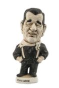 THE RUGBY UNION / FILM CLUB HOUSE: GROGG MODEL OF JOHN WAYNE BY JOHN HUGHES standing on a titled