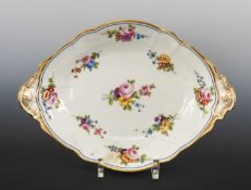 LARGE NANTGARW OVAL FAN HANDLED DISH circa 1817-1820, interior decorated with colourful flower