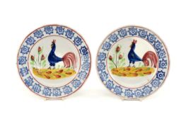 PAIR OF LLANELLY COCKEREL TEA PLATES interior with typical full polychrome decoration, sponged