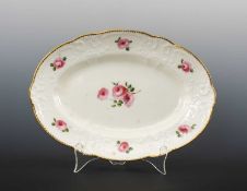 NANTGARW PORCELAIN OVAL DISH circa 1818-1820, typically moulded with c-scrolls and flowers,
