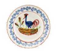 LLANELLLY POTTERY COCKEREL PLATE having a typical painted cockerel centred upon a landscape,