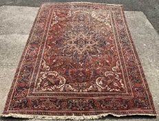 EASTERN WOOLEN RUG, red ground with floral pattern throughout, 350 x 234cms Provenance: private