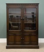 PLUS LOT 22 - BELIEVED ERCOL BOOKCASE CUPBOARD, two glazed upper doors over two cupboard doors,
