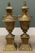 FINE PAIR OF BRASS TWIN HANDLED CAMPANA TABLE LAMPS, on block square bases, relief throughout, 85cms