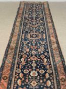 PERSIAN WOOL RUNNER, blue ground with central square motif, 420 x 102cms Provenance: private