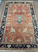 PERSIAN RED GROUND RUG, geometric border, 260 x 182cms Provenance: private collection Conwy